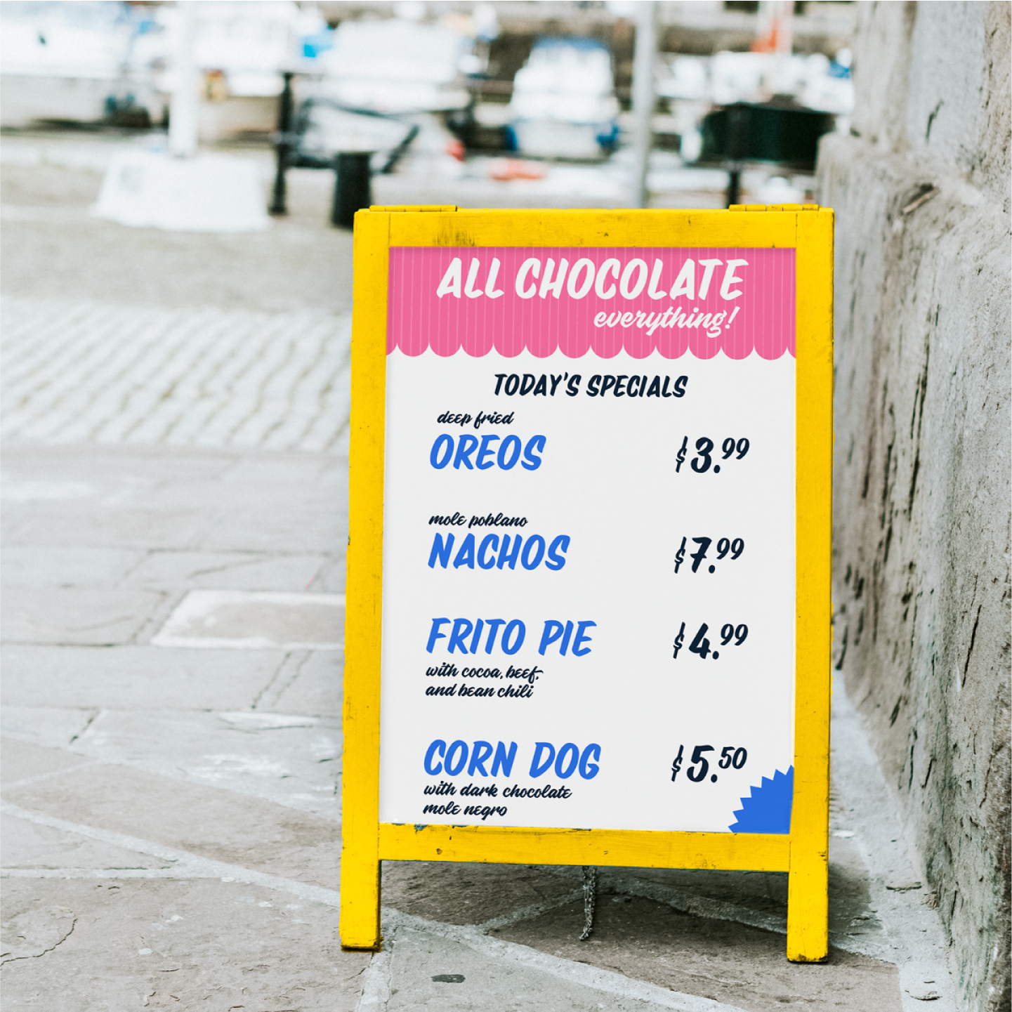 Boardwalk sign detailing "all chocolate" versions of popular boardwalk and fair foods in a yellow frame